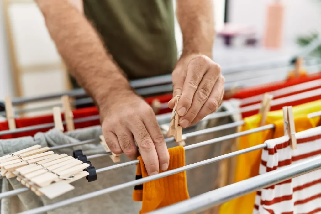 Close up of person hanging washing