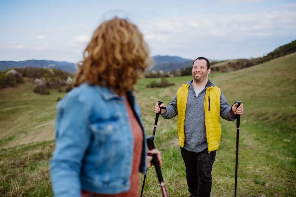 Disabled man on hike with support worker