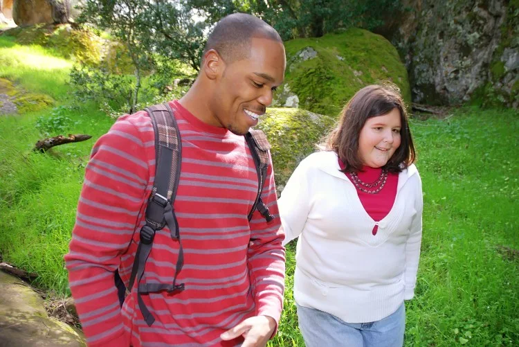 Support worker on walk with disabled woman
